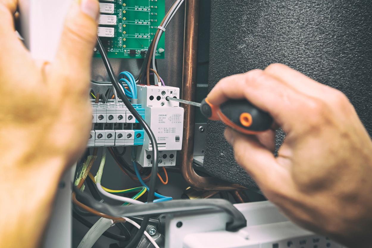 Electrician adjusting a consumer unit